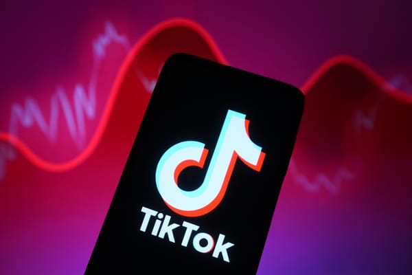 In this photo illustration, a TikTok logo is seen displayed on a smartphone screen.