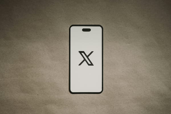 The X logo displayed on a smartphone