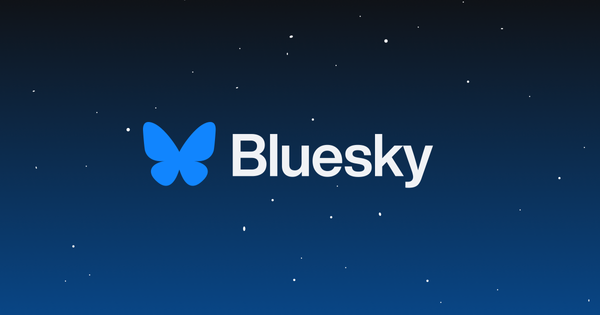 Bluesky logo over nighttime sky scene with stars